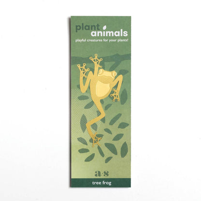 Little brass tree frog designed to hang on houseplants, a unique and delightful gift for plant lovers, available for purchase from The Petal and Plant Company