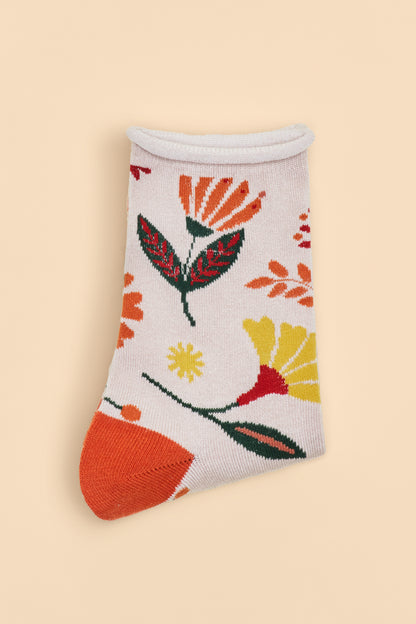 Watercolour Flowers Ankle Socks in cream with orange heels and toes, decorated with an orange, yellow, and green floral design, a perfect gift option from The Petal and Plant Company.