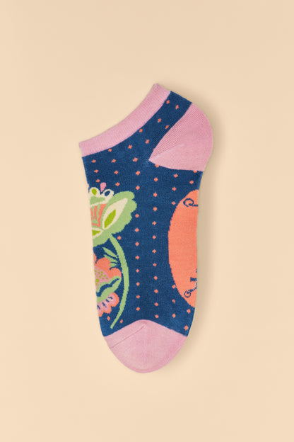 Scandinavian Stems Trainer Socks in navy with pale pink accents and a green flower design, displayed unworn, a charming gift option from The Petal and Plant Company.