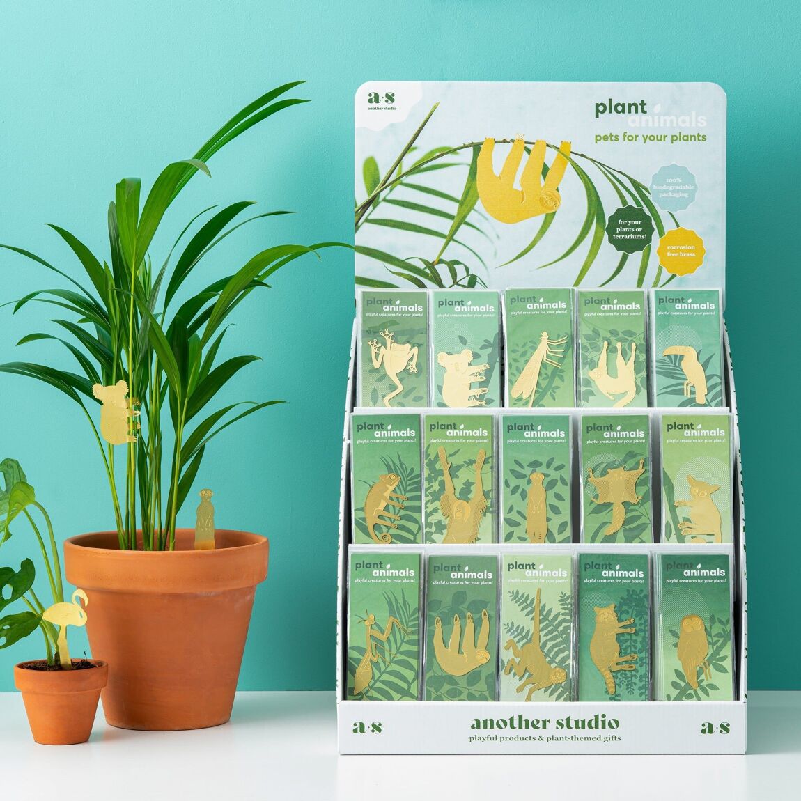 Selection of brass plant animals on display, featuring unique designs to decorate houseplants, available from The Petal and Plant Company.